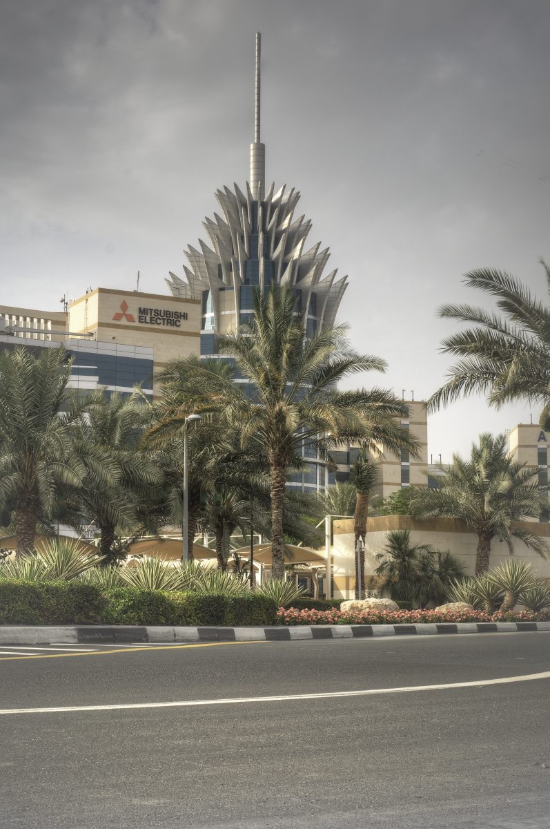 View across Dubai Silicon Oasis showing low-rise technology park buildings and residential blocks, photographed in 2015.