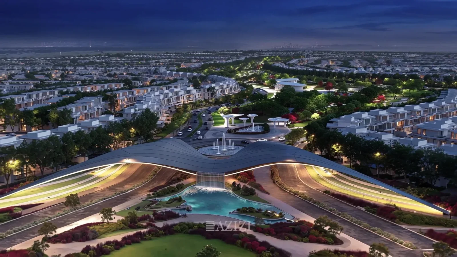 Aerial night view of Azizi Florence in Um Fanain, Sharjah, with illuminated boulevards running through the master community