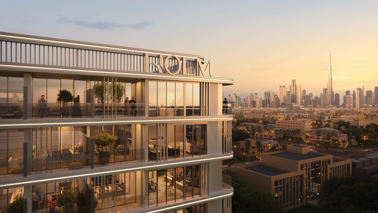 Curved balconies and full height glazing at LINEA by HOLM at sunset, looking across Satwa to Burj Khalifa