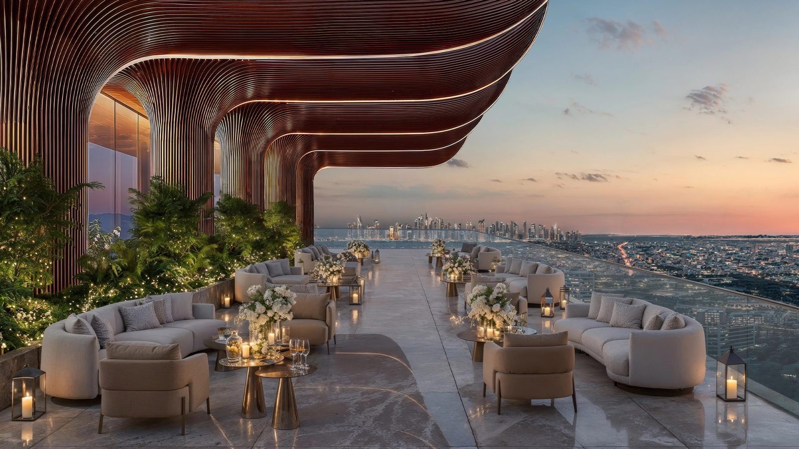 Open-air terrace lounge at Shahrukhz with fluted columns and seating, looking over Dubai at sunset