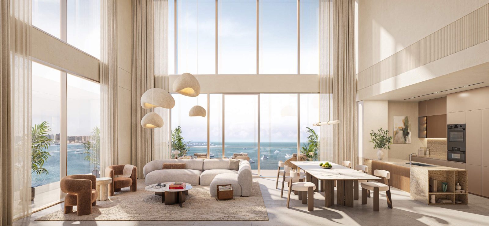 Double-height living room in a duplex at SOMA Residences with full-height glazing onto the sea