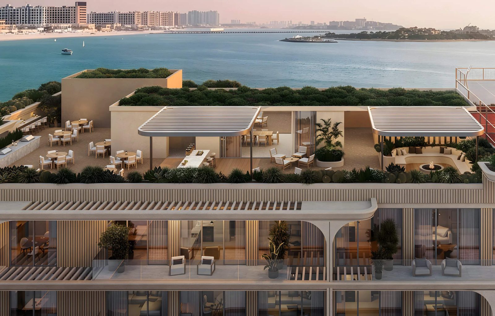 Rooftop terrace at SOMA Residences with shaded seating and a view across the water toward the mainland